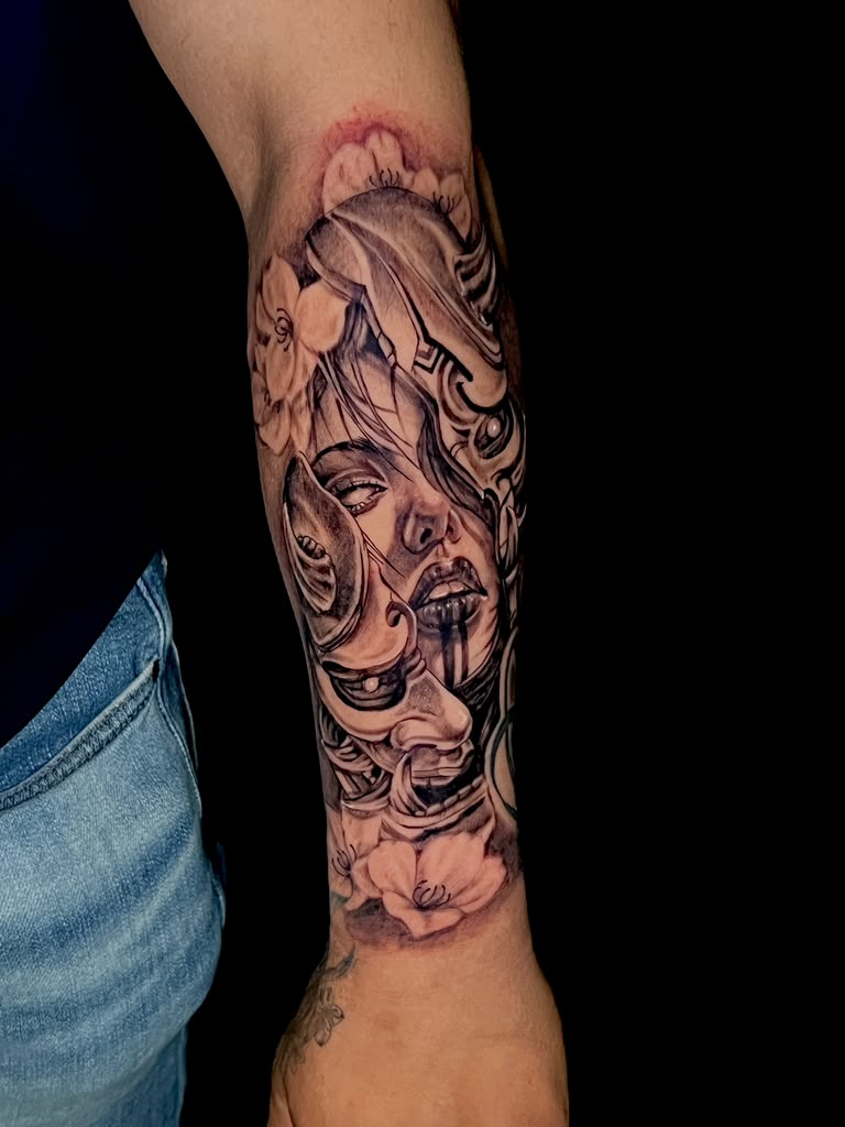 Black and grey woman portrait tattoo with ornamental filigree on forearm by Alison at Inked City Tattoos in Trenton, NJ